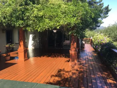 Soquel Hills Uniform Hue Deck Stain — House Painting Services project by Transformational Color
