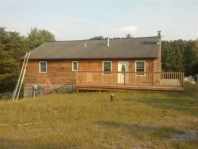 Log Cabin Stripping and Staining — House Painting Services project by William Buckham Painting, LLC