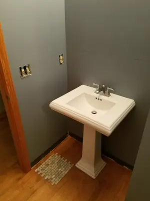 Travertine Backsplash for the Powder Room — House Painting Services project by Hometerior Finishing, LLC.
