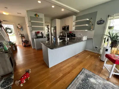Dual Color Kitchen Cabinet Painting in Olympus White and Morning Fog — House Painting Services project by Chamberland Professional Painting