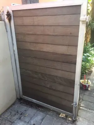 Stained and Refinished Gate — House Painting Services project by CertaPro Painters Of North Miami