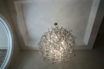 Entryway and Stairway Makeover Featuring a Stunning Chandelier by Surroundings By Natureworks