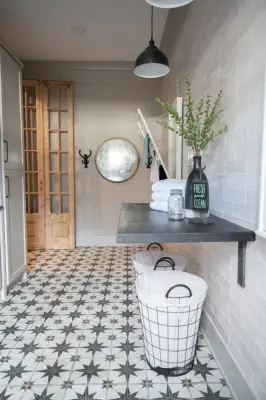 Contemporary Farmhouse Laundry Space by Bret Franks Construction, Inc.