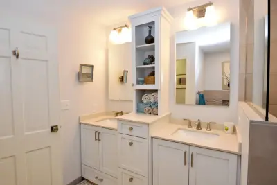 Multiple Bathroom Renovation by EdgeWork Design Build