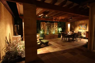 Exotic outdoor dining room by Michael Glassman & Associates
