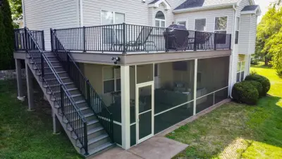 Screened Room Under an Open Deck by Heartlands Building Company
