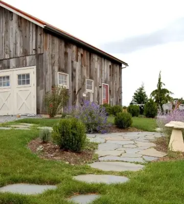 Repurposed Barn Garage by New Energy Works Timberframers