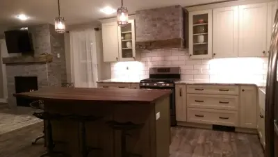 Mushroom Cabinets with Sage Island in Marlette Transitional Style — Kitchen Remodeling project by Vassar Building Center Inc