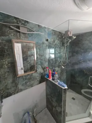 Onyx Marble Shower Excellence — Home Renovation & Remodeling Services project by Level Up Construction & Investment Group LLC