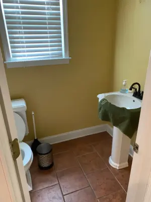 Powder Room Remodel – Monochrome Flooring and Oak Vanity — Home Renovation & Remodeling Services project by Caliber Construction NJ & PA