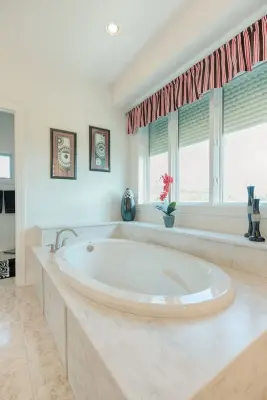 Raincloud Shower and Bathtub Enclosure — Home Renovation & Remodeling Services project by First Choice Home Remodeling