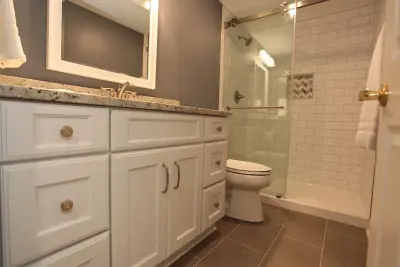 Revitalizing Basement Bathroom — Home Renovation & Remodeling Services project by Booher Remodeling Company