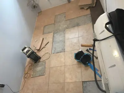 Floor Tile Replacement After Water Damage Repair — Home Renovation & Remodeling Services project by Big Horn Construction, LTD