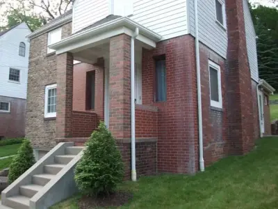 Brick and White Siding Exterior Coating — House Painting Services project by ImageWorks Painting Inc.