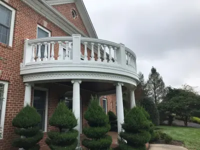Cockeysville Residence: Railing and Column Painting, Front Door Staining — House Painting Services project by Parviz Painting MD LLC