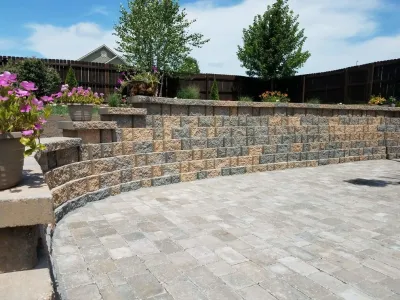 Paver patio and retaining wall — Landscape Construction project by Garden Gate Lawn & Landscape, LLC in Raymore