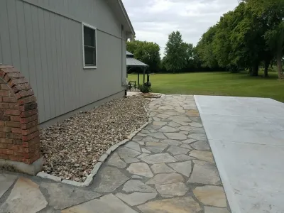 Flagstone walkway — Landscape Construction project by Garden Gate Lawn & Landscape, LLC in Raymore