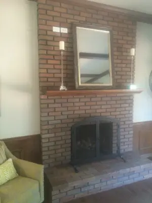 Fireplace brick modification — House Painting Services project by Color Craftsmen: Fireplace Makeovers