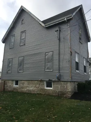 Charcoal House Exterior Coating — House Painting Services project by Pure Colors Painting And Decor, LLC