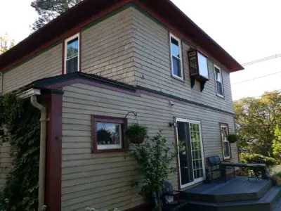 House Renovation: Board Repair, Cedar Shingle Trim, Priming and Painting — House Painting Services project by Tinos Painting And Carpentry