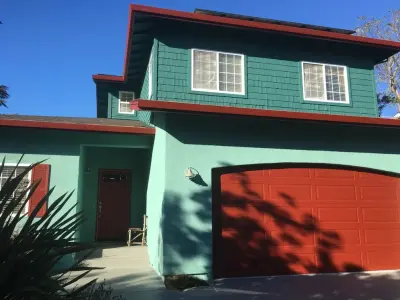 Exterior in Blue-Green with a Red Garage — House Painting Services project by Transformational Color