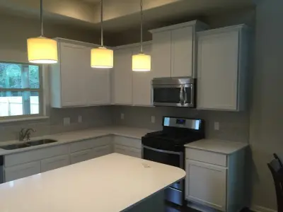 Luminous White Kitchen Cabinets — House Painting Services project by Austin's Paint Guys