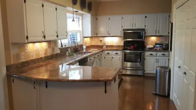 Cabinet Transformation - From Dark Wood to White Paint — House Painting Services project by Wallscapers Kitchen & Bath Innovations