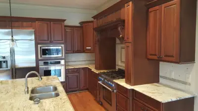 Cherry Cabinet Restoration — House Painting Services project by Wallscapers Kitchen & Bath Innovations