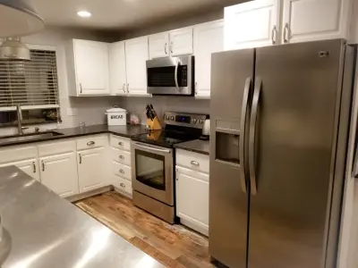 Modern Kitchen with Stainless Steel Island Counter — House Painting Services project by All Terrain Painting & Repairs NW