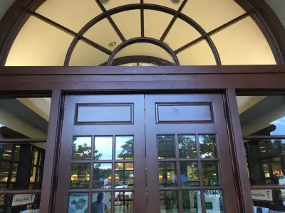 Exterior Custom Doors and Window Trim — House Painting Services project by Sarasota Painting & Wall Covering