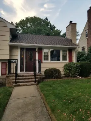 Exterior fresco cream sw7719 shingles and rustic red sw7593 shutters — House Painting Services project by CertaPro Painters Of Princeton