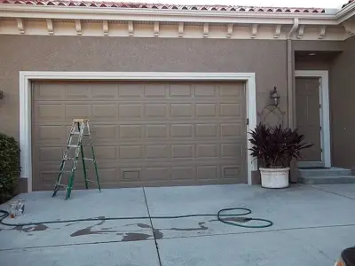 Garage door refurbishment — House Painting Services project by AVR Painting Services Inc.
