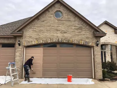 Garage Door Refinishing — House Painting Services project by Masterpiece Painting And Cabinetry LLC
