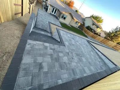 Paver Patio with Retaining Wall and Upper Deck — Landscape Construction project by Jefe's Landscaping