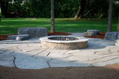 Outdoor Fire Pit and Patio with Seating Stones — Landscape Construction project by Tingley Landscapes