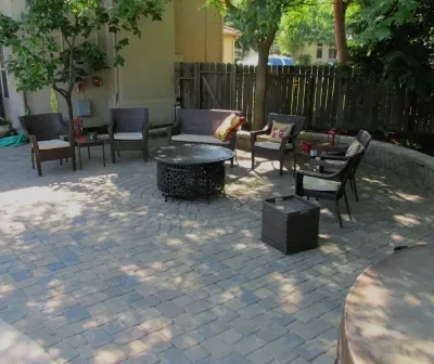 Socially Crafted Backyard — Landscape Construction project by R Lacy Interlocking Pavers