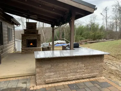 Fireplace and Grill Island for the Cabin by Schellhaas Landscape Construction