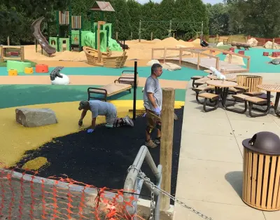Cranberry NJ community playground bridge — Landscape Construction project by Handcrafted Garden Bridges