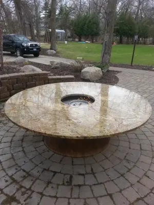 Bespoke Granite Fire Pit by Precision Landscape & Irrigation, LLC