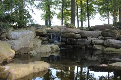 Water Garden Project for Golf Course Pond and Waterfall — Landscape Construction project by Wichman Landscape & Construction