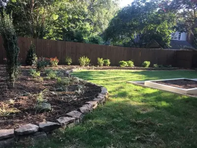 Memphis Outdoor Space with Stone Edging, New Fencing, and Elevated Flower Beds — Landscape Construction project by Mid-South Curb Appeal, LLC