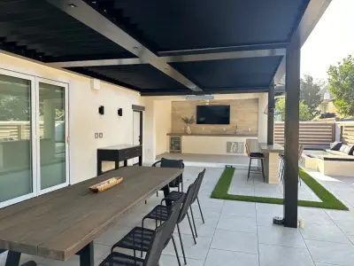 Patio Cover with Louvers, Bar, and Fountain — Landscape Construction project by Landscape Locators