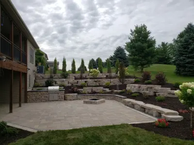 Outdoor Living Space with Rosetta Outcropping Stone — Landscape Construction project by Outdoor Innovations
