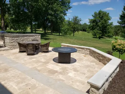 Outdoor Space with Travertine Elements — Landscape Construction project by Outdoor Innovations