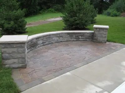 Outdoor Living Space with Pool Landscaping and Waterfall — Landscape Construction project by Outdoor Innovations