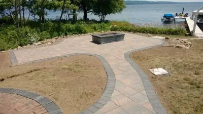 Outdoor space featuring a gas fire pit — Landscape Construction project by Marlinski Landscape & Stone Work