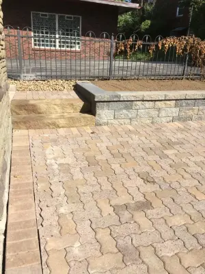 Revitalize Omni Stone Paver Driveway — Landscape Construction project by Wichman Landscape & Construction