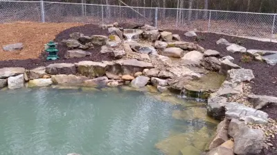 Aiken SC Swimming Pond Featuring Waterfall and Stream — Landscape Construction project by McCormick Landscaping / Aquatic Solutions