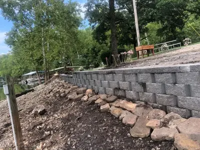 Rock Retaining Structure — Landscape Construction project by R&D Lawn Care And Landscaping