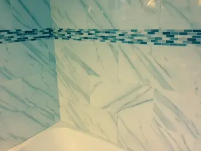 marble bathtub and shower enclosure — Home Renovation & Remodeling Services project by Home Preservation Specialists Inc